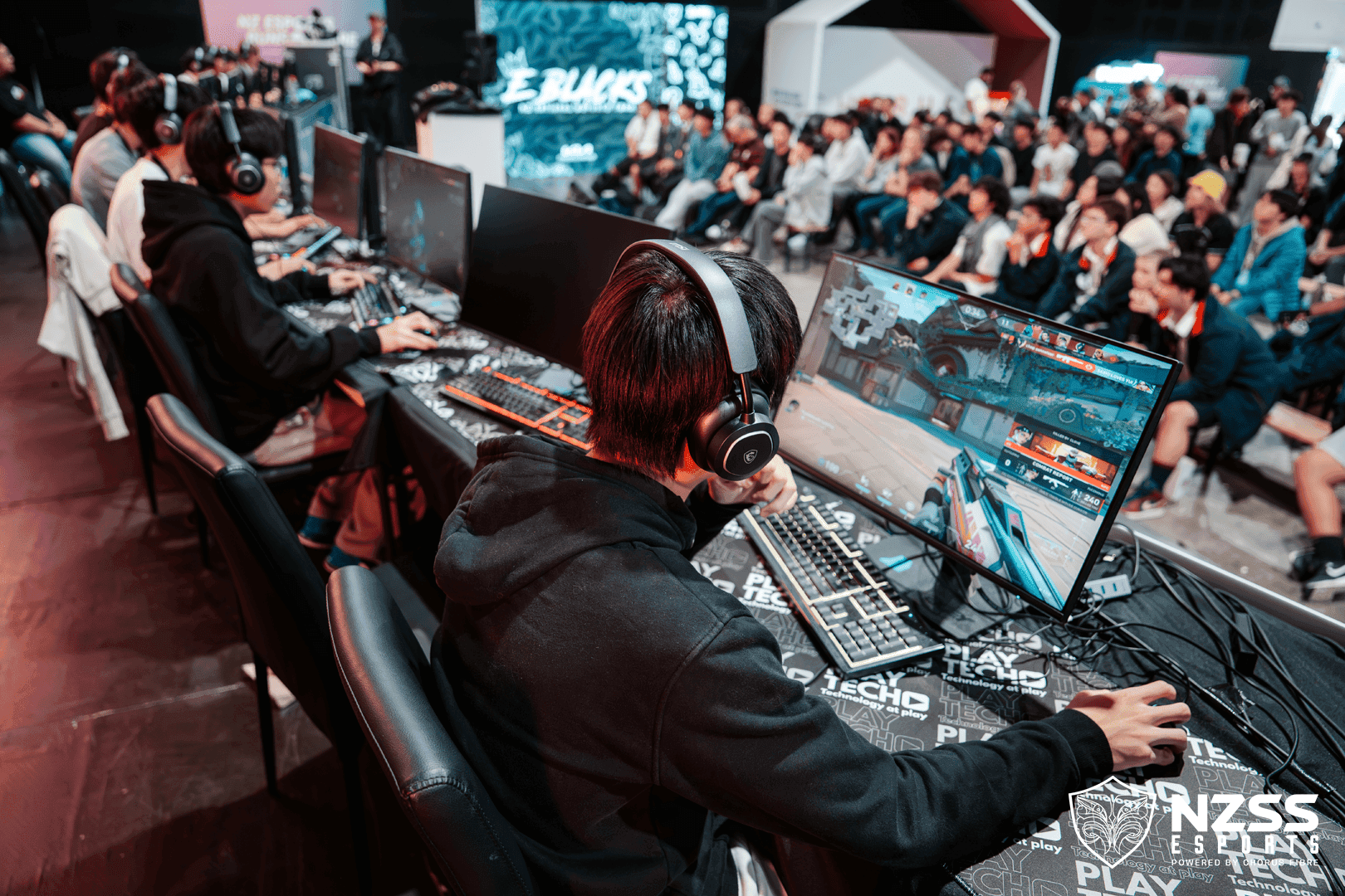 Student wearing a headset during an esports match